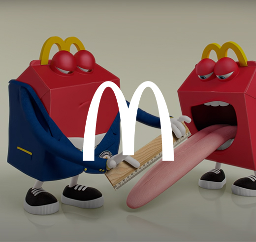 mcdonalds logo on top of image of two animated happy meal boxes